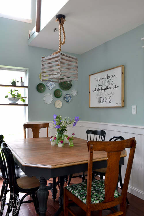 Room makeover completed for under $100 - including a new table and chairs! Vintage modern farmhouse dining room with plate gallery wall and DIY wood sign with quote.