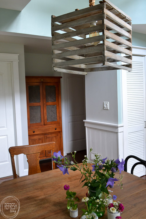 Room makeover completed for under $100 - including a new table and chairs! Vintage modern farmhouse dining room with plate gallery wall and DIY wood sign with quote.