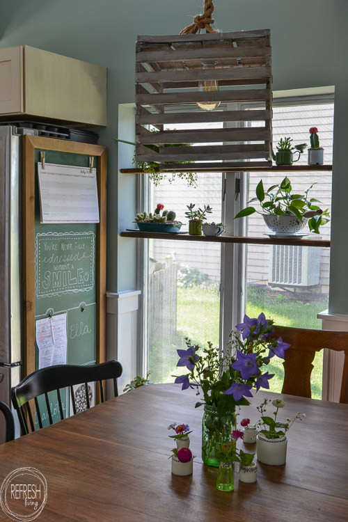 Room makeover completed for under $100 - including a new table and chairs! Vintage modern farmhouse dining room with plate gallery wall and DIY wood sign with quote.