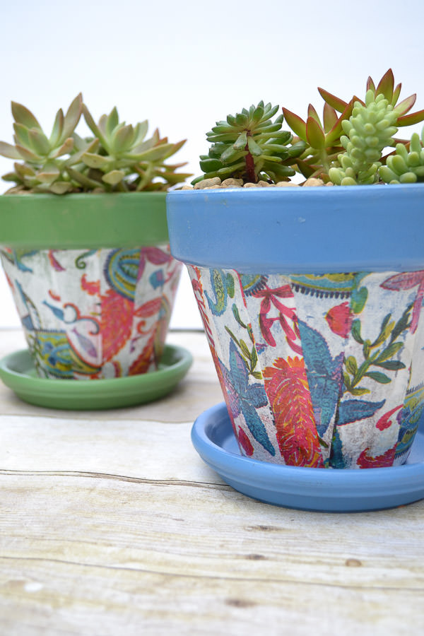 Cheap pots get an update for summer with spray paint and decoupaged napkins.