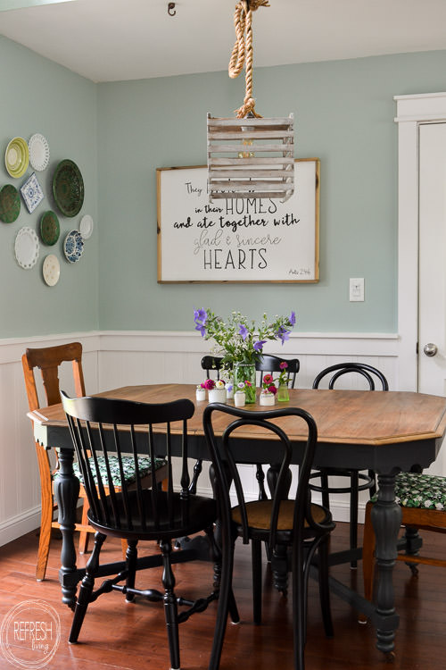 Room makeover completed for under $100 - including a new table and chairs! Vintage modern farmhouse dining room with plate gallery wall and DIY wood sign with quote.
