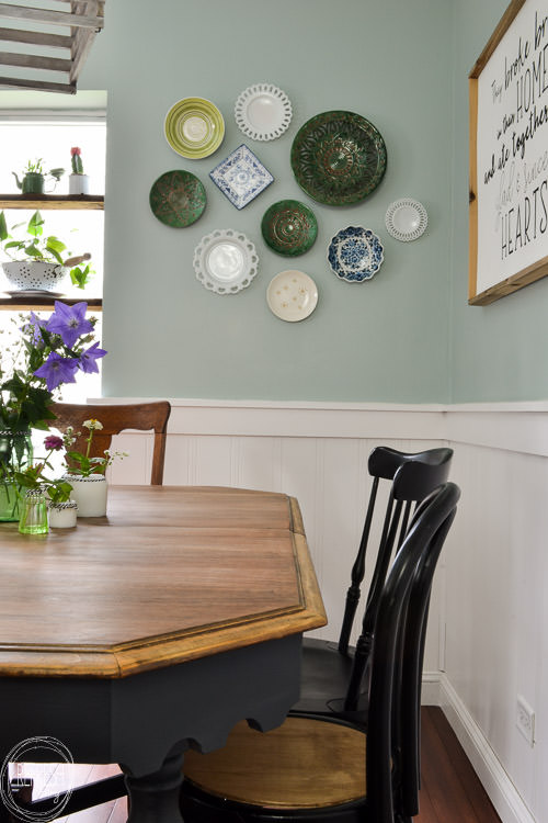 Room makeover completed for under $100 - including a new table and chairs! Vintage modern farmhouse dining room with plate gallery wall and DIY wood sign with quote.