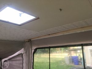 Glue up ceiling panels are an easy way to update a ceiling in a camper (or home). These panels covered up some water damage after the roof was repaired.