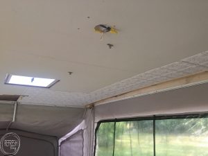 Glue up ceiling panels are an easy way to update a ceiling in a camper (or home). These panels covered up some water damage after the roof was repaired.
