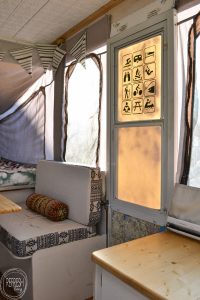What a cool idea to update a door of a camper. I love the parks and recreation symbols of all the fun things to do while camping. Pop up camper remodel with an eclectic vintage boho feel via Refresh Living.