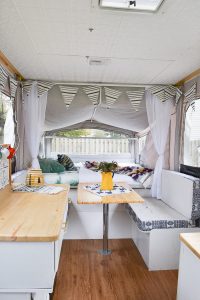 I want to camp in this! A 1990s pop-up camper gets a complete remodel, including a new roof to replace the leaky one. Pop up camper remodel with an eclectic vintage boho feel via Refresh Living.