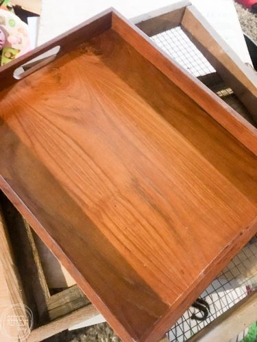 An old wooden tray from the thrift store is upcycled into a beautiful DIY gift for a new homeowner.