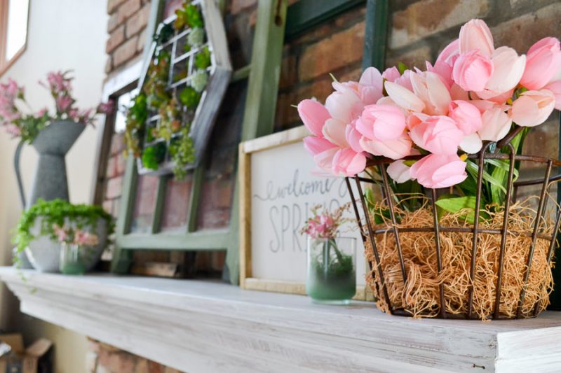 This spring decor has a vintage farmhouse feel. Mantel decorated for spring with green and pink, old windows, and succulents. Spring home tour with upcycled and vintage finds.