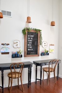 Vintage letterboard in a home office with desks for the kids. Spring home tour with upcycled and vintage finds.