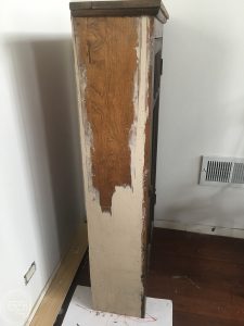 One way to repair peeling or missing wood veneer is to build the surface back up with wood filler.