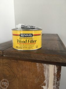 One way to repair peeling or missing wood veneer is to build the surface back up with wood filler.