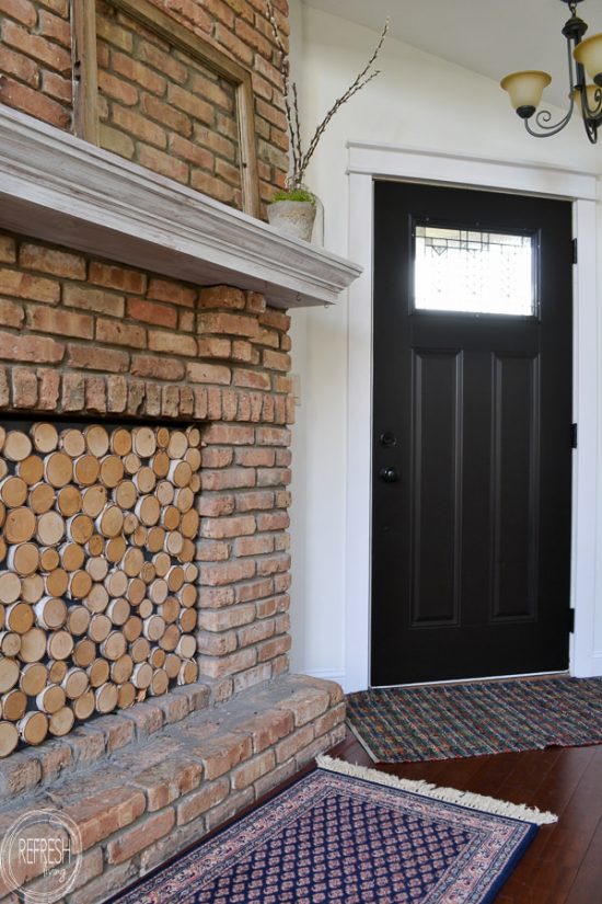 Contrasting black front door with white walls in an eclectic vintage modern living room.