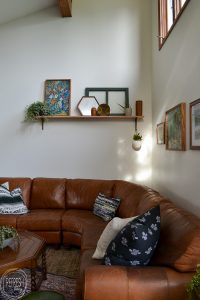 This living room is full of second hand finds. I love the vintage modern feel with eclectic finds and greenery and plants.