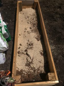 Don't waste money and buy the premixed raised garden bed soil blend, instead, make your own for a lot less! This easy soil mixture combines only three parts and is easy to make, plus it will create proper drainage for your vegetables.