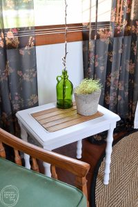 This farmhouse table painted white with wood slats used to be a table with broken caning. What a good idea on how to fix broken caning in benches and chairs.