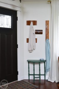 This is the size of my entryway too - a small wall right by the door. Love the idea of using drawer fronts to make a decorative coat rack right by the door!