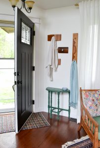 Love this idea for a coat rack for a small entryway! It's decorative and functional, and even better, it reuses old items (dresser drawer fronts) that would otherwise be thrown away.