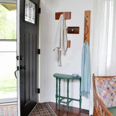 Love this idea for a coat rack for a small entryway! It's decorative and functional, and even better, it reuses old items (dresser drawer fronts) that would otherwise be thrown away.