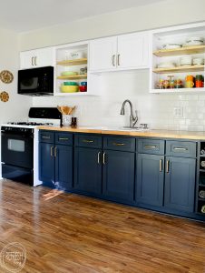 Love the dark blue with the butcher block countertops and the white upper cabinets. This kitchen was refaced (cabinet doors replaced), but the existing cabinet bases remained.
