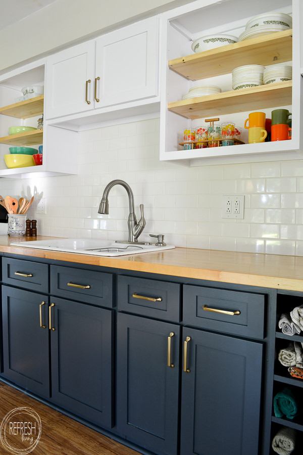 Love the dark blue with the butcher block countertops and the white upper cabinets. This kitchen was refaced (cabinet doors replaced), but the existing cabinet bases remained.