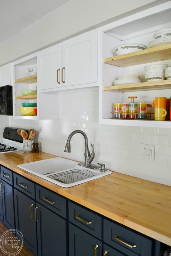 What an easy way to make open shelves in your kitchen! Just remove the doors, cut out the stile, paint the inside of the cabinet, and add thicker shelves.