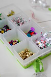 Gather odds and ends and left young kids fill up clear ornaments with them. A great craft for holiday classroom parties!