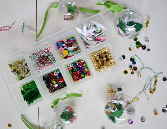 Gather odds and ends and left young kids fill up clear ornaments with them. A great craft for holiday classroom parties!