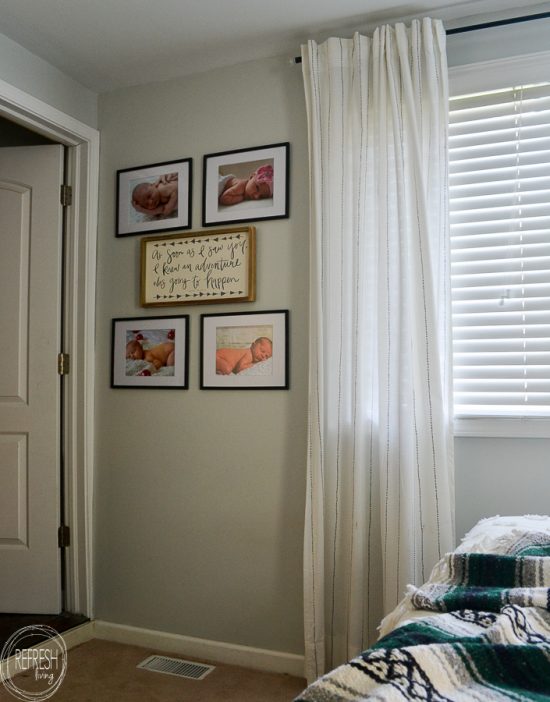 Check out this master bedroom makeover completed with refinished furniture, a DIY modern headboard, a painted black feature wall, vintage fabric and a kids art display.