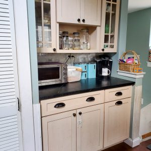 This boring kitchen with off white cabinets is going to be updated into a modern kitchen with vintage touches.