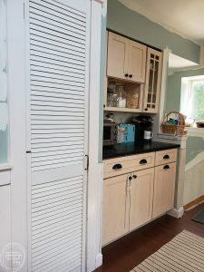This boring kitchen with off white cabinets is going to be updated into a modern kitchen with vintage touches.