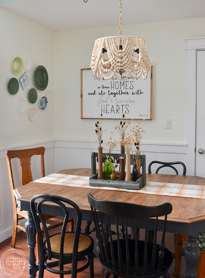 This DIY beaded chandelier was made from a $10 thrift light fixture, an old lampshade, and lots of beads. It saved me hundreds to make this instead of buying it new.