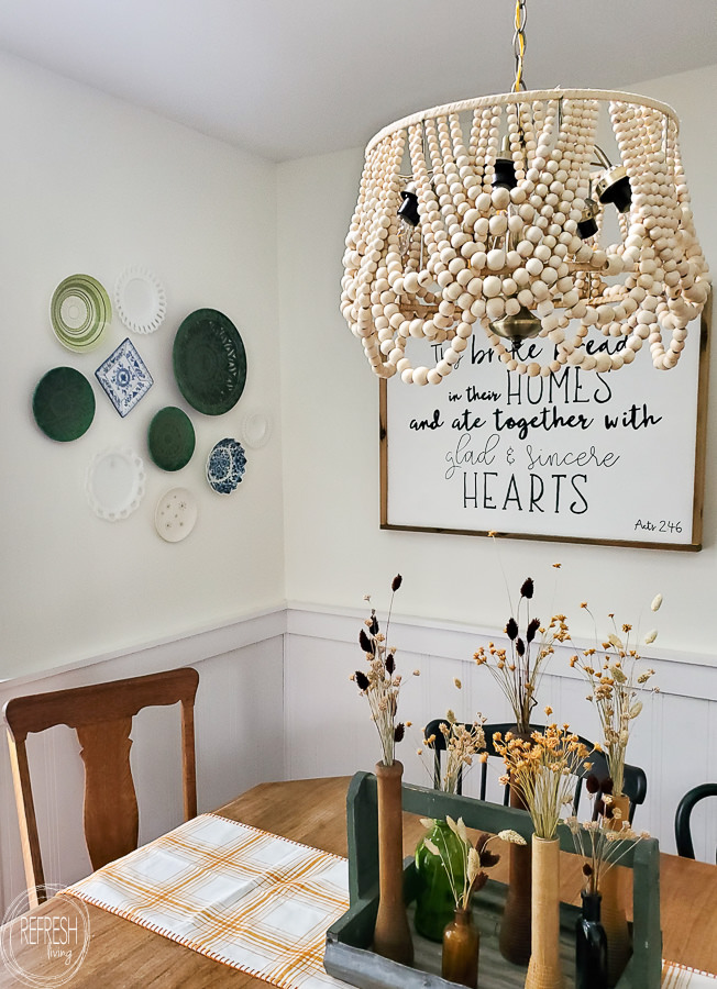 This DIY beaded chandelier was made from a $10 thrift light fixture, an old lampshade, and lots of beads. It saved me hundreds to make this instead of buying it new.