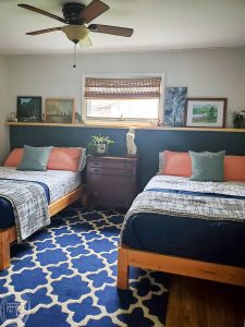 What a great way to create the look of a headboard without spending a lot of money or time. The wood shelf can be decorated in so many different ways.
