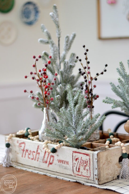 Use a vintage soda crate to create a unique Christmas centerpiece.