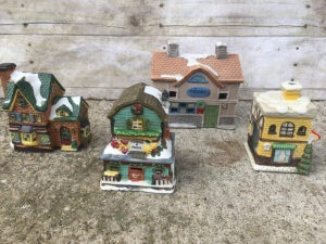 Easy way to update mismatched ceramic houses from the thrift store to create a farmhouse Christmas village.