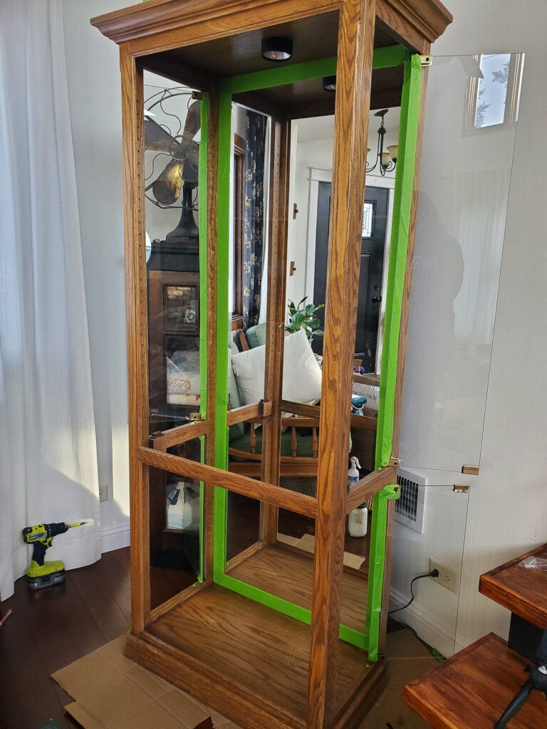 Display curio cabinet used to make an indoor greenhouse