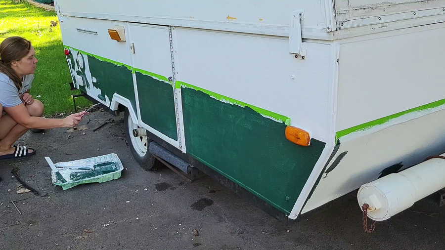 green and white painted pop up camper