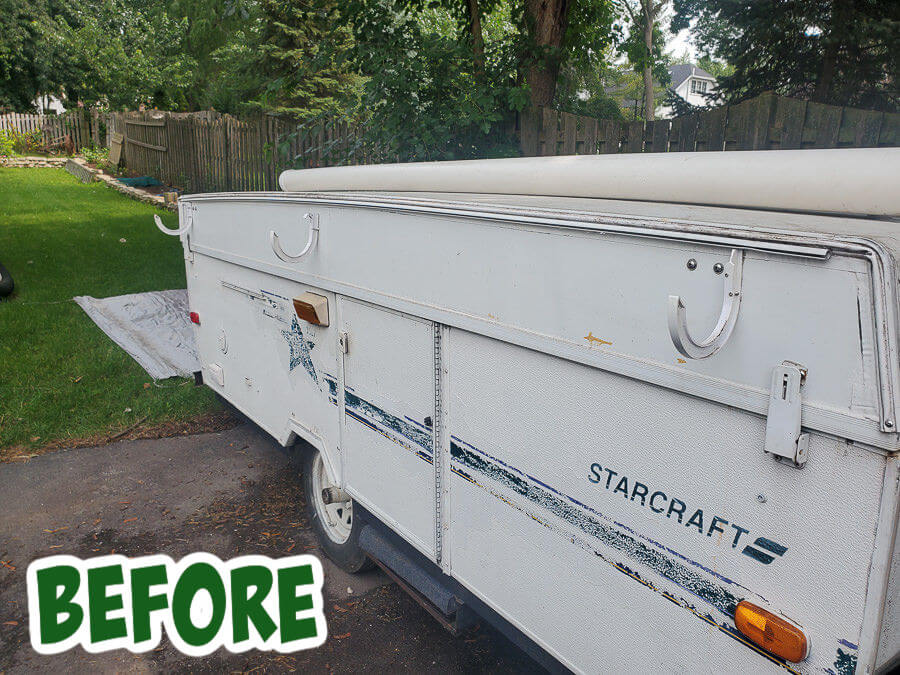 before image of Green and white painted camper with tree stencils pop up camper remodel