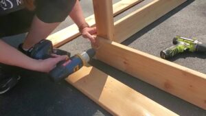 how to attach boards to posts in raised garden bed