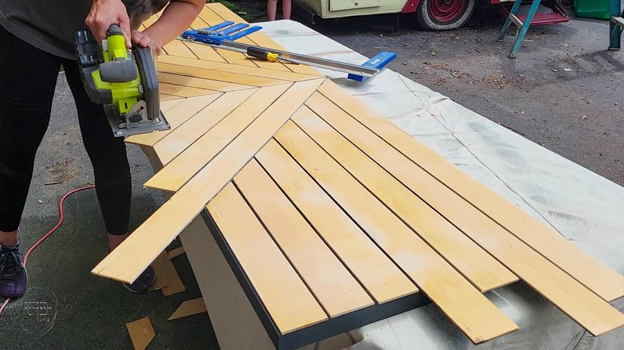 add plywood strips to hollow core door to create a modern wood door and cut with circular saw