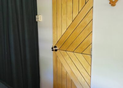 rv door update with wood - modern wood door in a camper