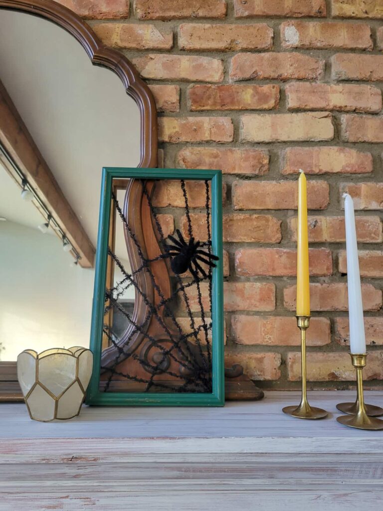 upcycled picture frame into spider web decorations for Halloween