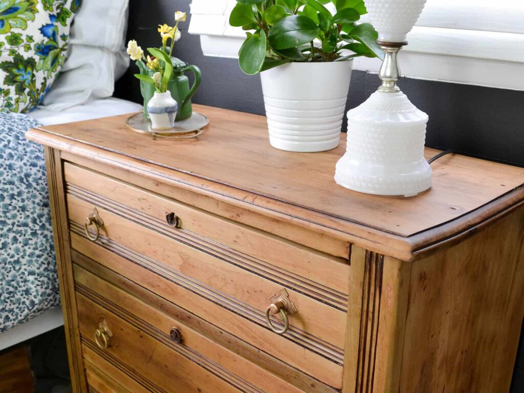 stripping furniture guide with a dresser that has been stripped down to natural wood