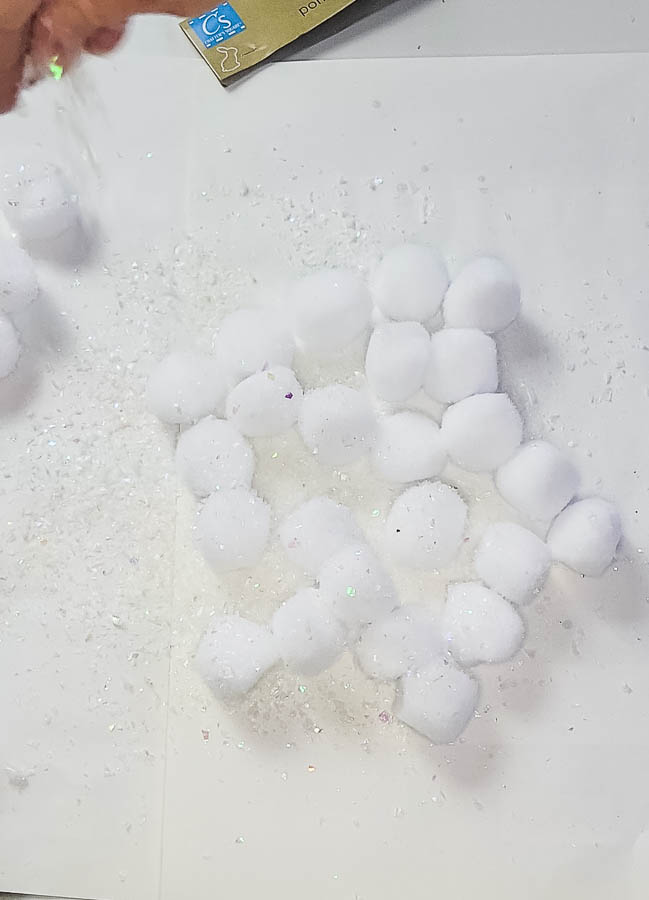 use spray adhesive and fake snow on cotton balls to make snowballs