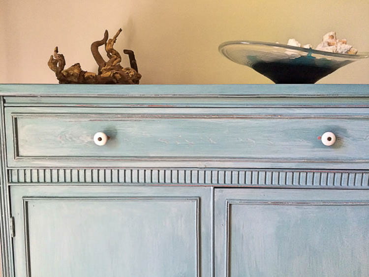 dresser painted with milk paint with bonding agent in light blue with white wash