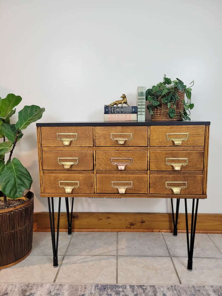 refinished vintage card catalog with natural quatersawn oak finish, hairpin legs, black top and brass pulls