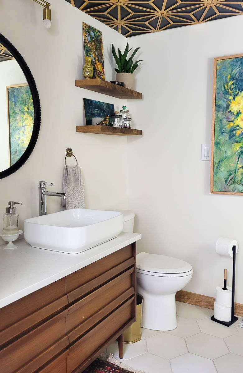 https://refreshliving.us/wp-content/uploads/2023/03/modern-bathroom-with-vintage-dresser-vanity-decorative-wood-ceiling-hexagon-tiles-and-floating-shelves-about-toilet-2.jpg