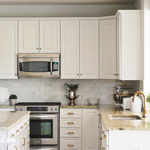white kitchen cabinets with gold pulls
